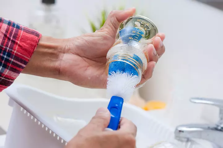 Use warm and soapy water to clean the milk bottles