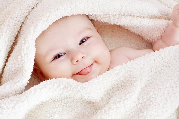 smiling newborn baby boy