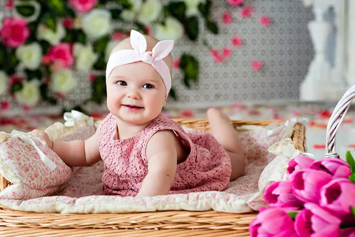 Wide-eyed smiling picture of happy baby