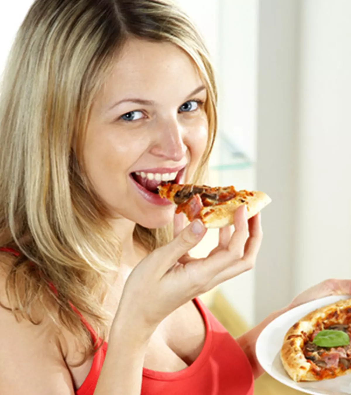 A Pregnant Woman Eating Grapefruit