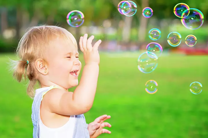 Pricking the soap bubbles and outdoor games for toddlers