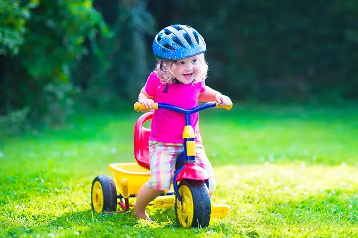 Riding a tricycle and outdoor games for toddlers