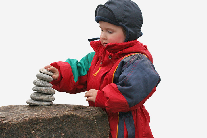 Stacking and balancing the rocks outdoor games for toddlers
