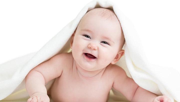 cute newborn baby boy smiling