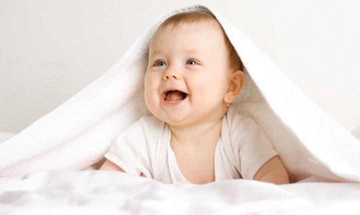 cute newborn baby boy smiling