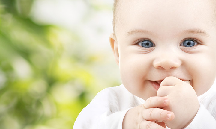 Cute baby with blue eyes smiling picture