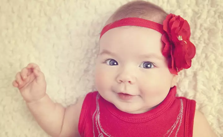 Smiling picture of baby in red