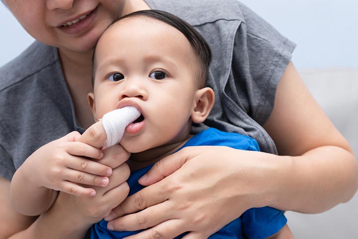 Clean your baby’s gum line with a gauze or soft cloth.