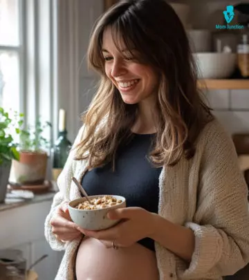 A pregnant lady pouring milk into a glass