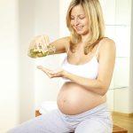 A woman is using almond oil during pregnancy