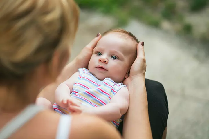 How to hold a baby in lap position