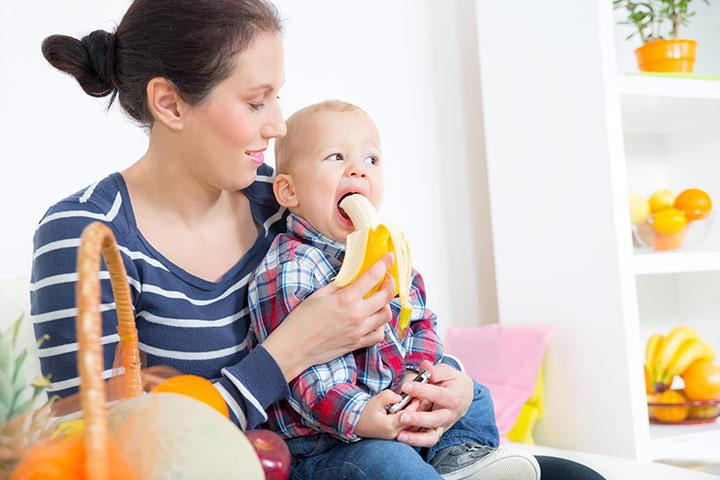 baby eating banana