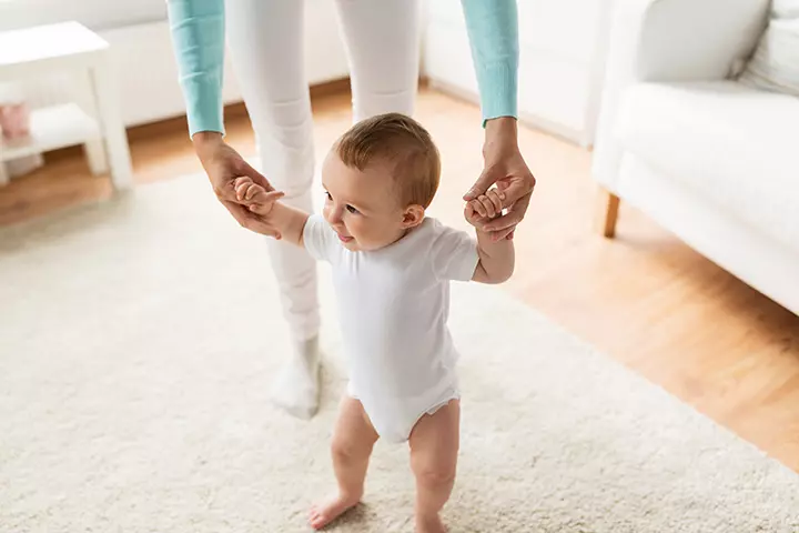 Bouncing on the legs activity for 6-month-old baby