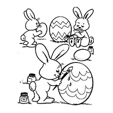Rabbits Painting Easter Eggs in the Garden Coloring Page