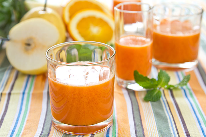 Carrot, pear, and orange healthy drink for kids