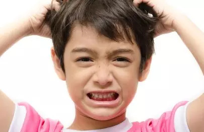 Dandruff In Kids: Causes, Treatment And Home Remedies