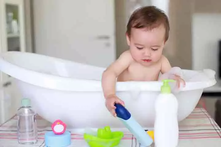 Babies may attempt to pick an object