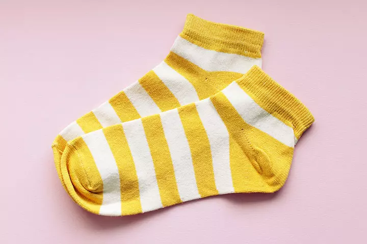 A pair of socks in new mom survival kit