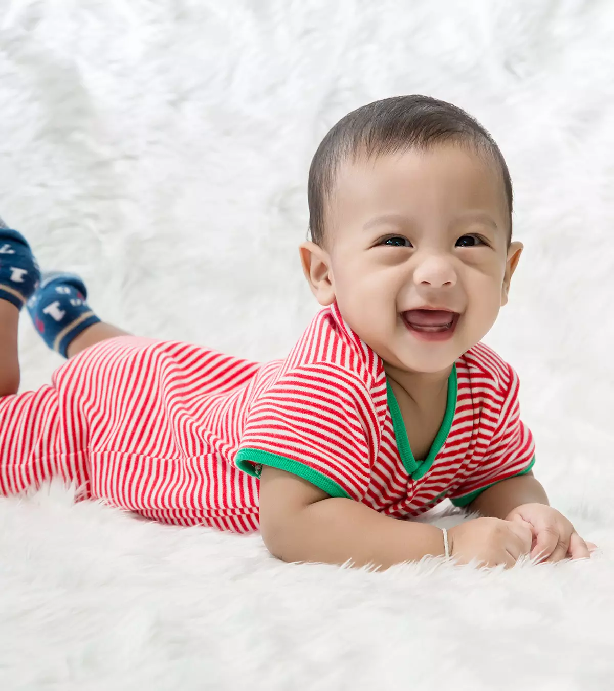 A small baby wears an office costume