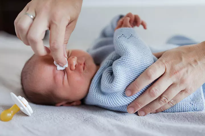 Baby rubbing eyes could happen due to irritation