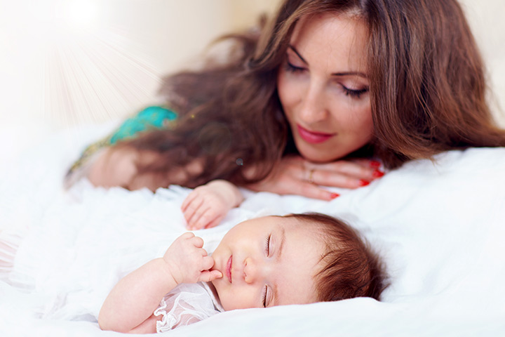 Mother and sleeping baby image