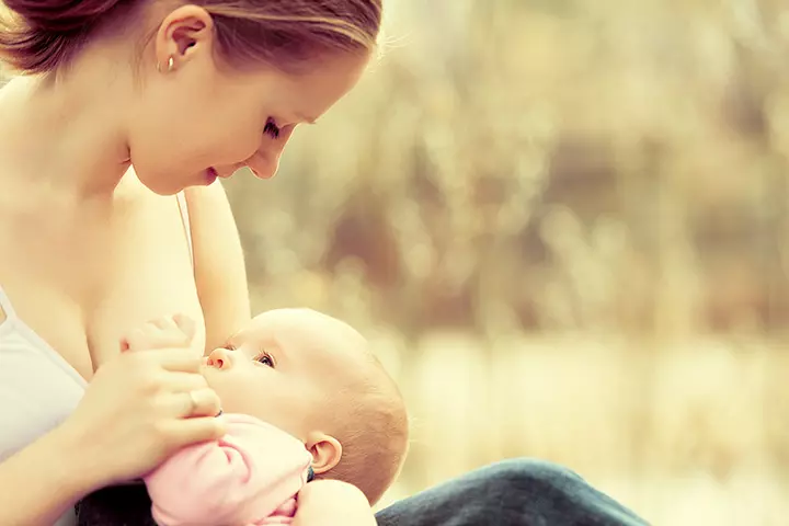 Breastfeeding mother and baby image