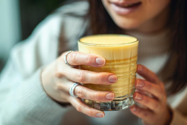 Warm milk with a pinch of turmeric once every few days is safe