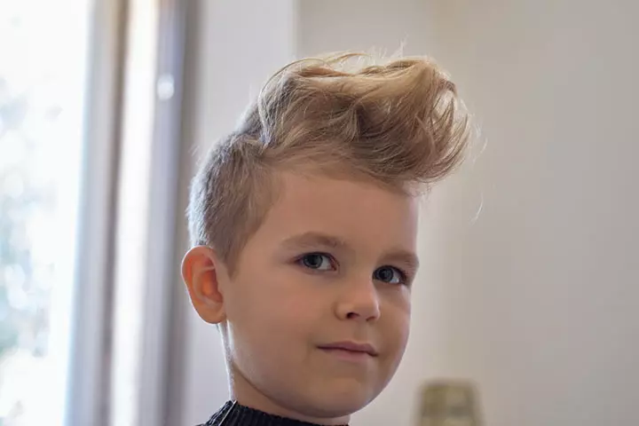 Little boy with Pompadour haircut.