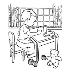 Boy eating milk and cookies coloring page