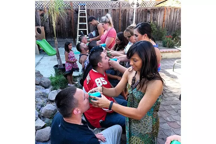 Baby bottle drinking competition for baby shower games