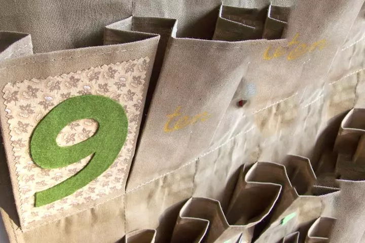 Advent calendar with a hanging shoe rack as Christmas craft for toddlers