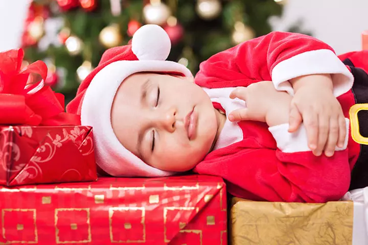 This cute Santa sleeps over the presents
