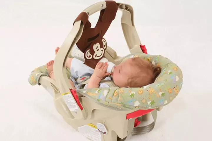 A bottle sling attachable to baby car seat is brilliant! No hassles while you take him out.