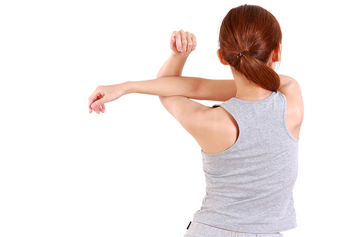 Crossbody shoulder stretching exercise for children