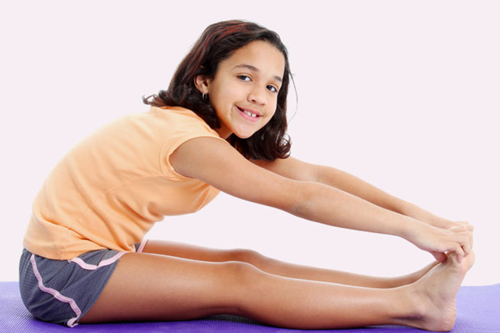 Seated toe touch stretching exercise for children