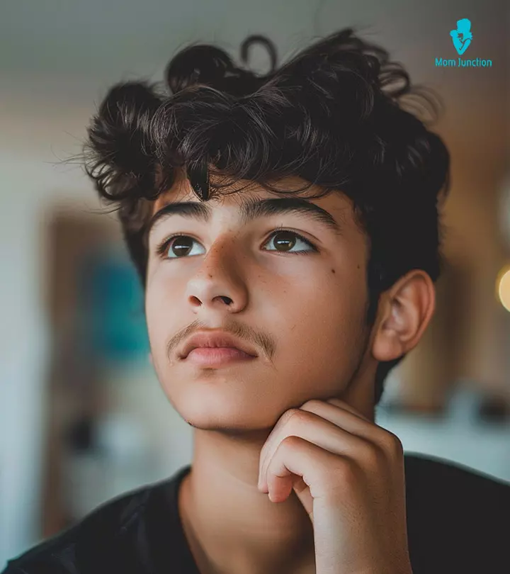 A Teenage Son And Father Shaving Beards