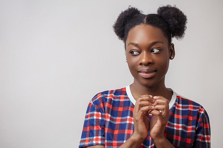 Space buns hairstyle for black teenager
