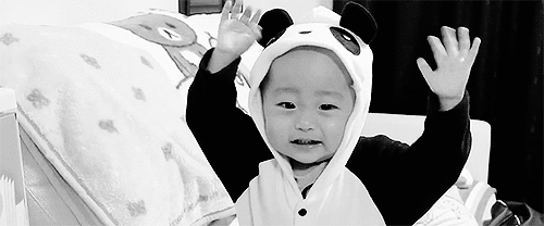 This baby doesn't care that he's wearing a panda hood. He just doesn't want a hood!