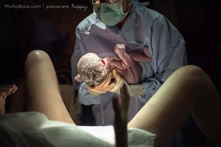 baby is passing between the womb and her mother.
