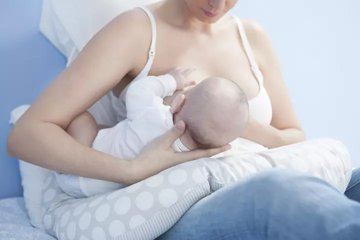 How to hold a baby in football hold position