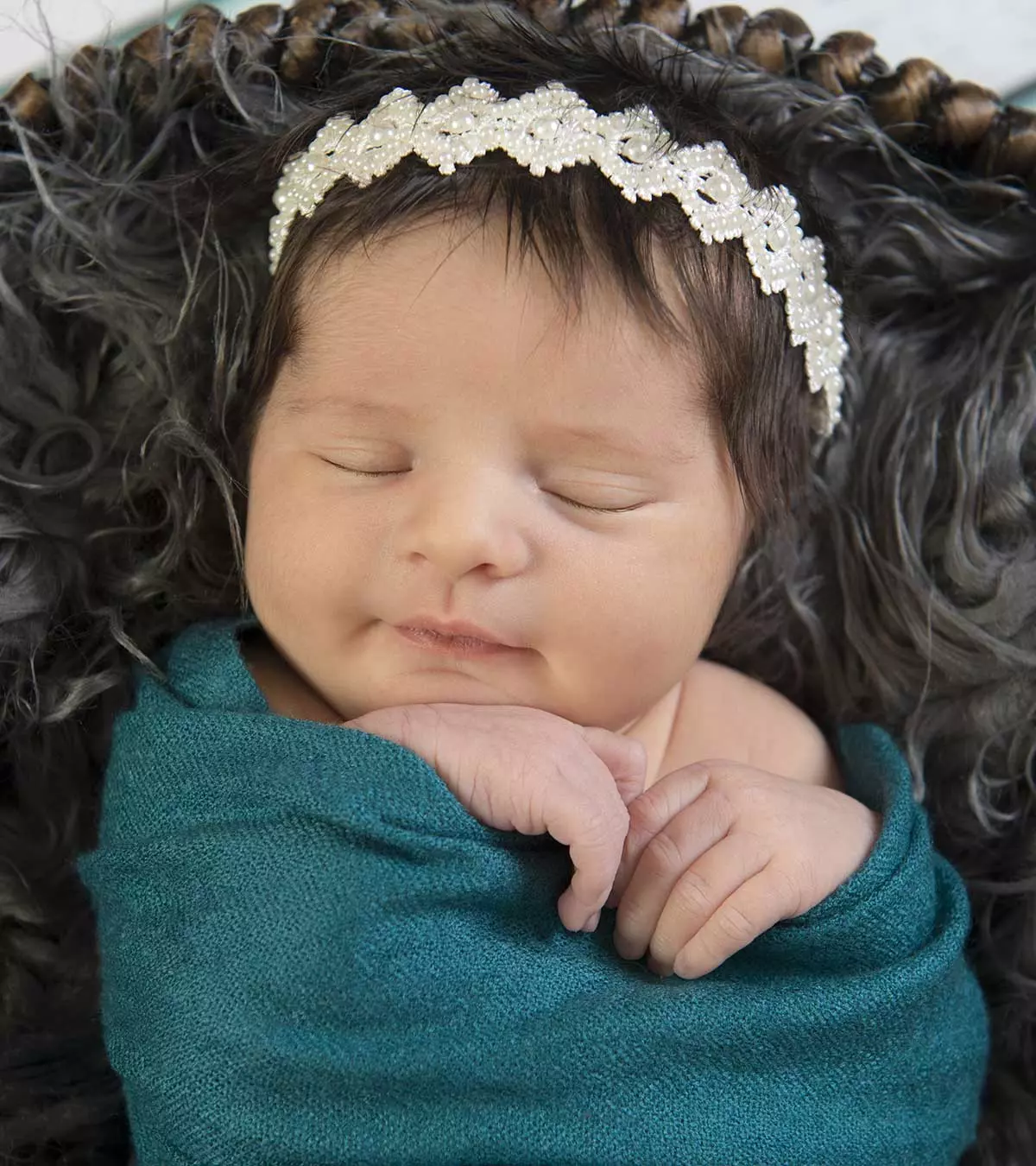 A cute baby with a beautiful headband