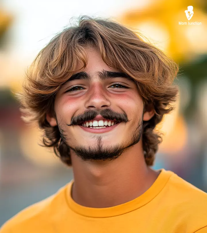 A teenage guy with a little moustache and beard