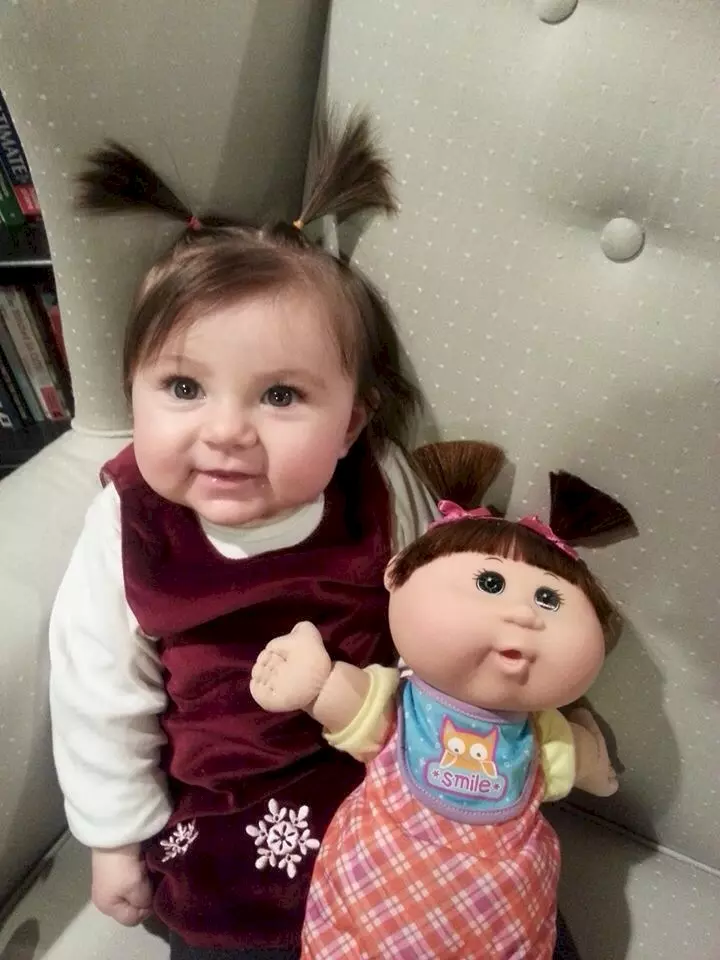 This little girl could pass off as a Cabbage Patch kid herself!