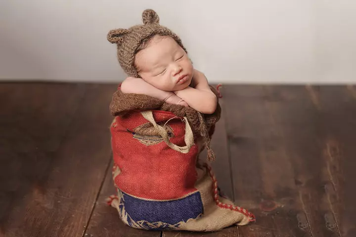 We love the way this baby sleeps in its burlap sack