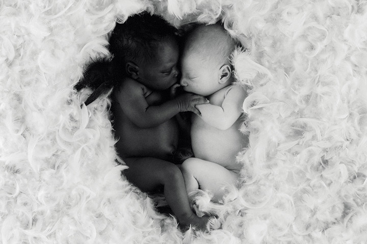 Babies know no colour. We love the way these babies hold each other together.