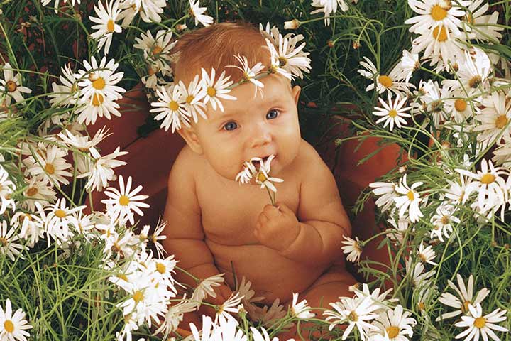 This cute kiddo steals the show with those daisies.