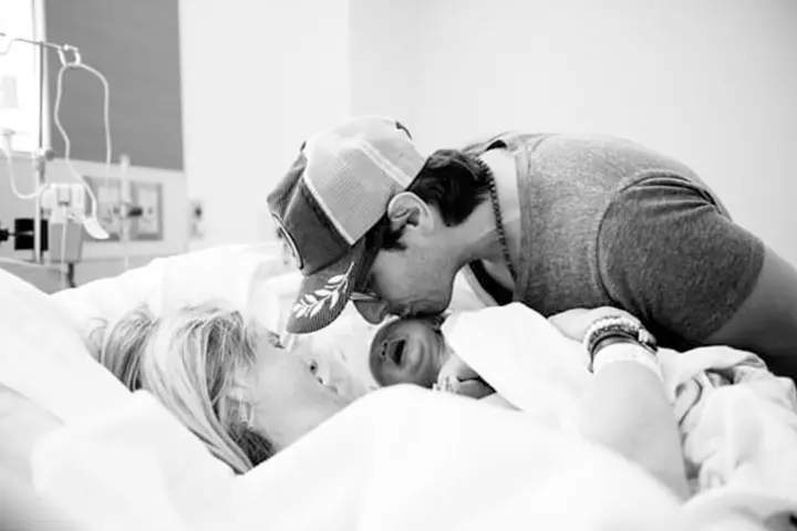 A father's vow sealed in a kiss.