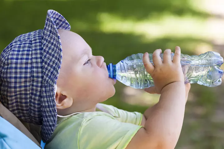 Giving Ready To Drink Water Bottles To Babies