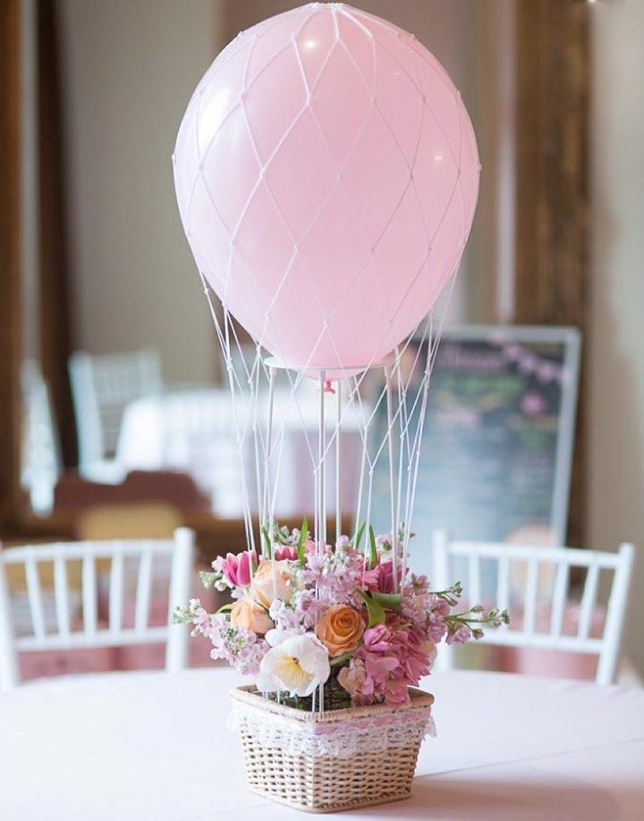 Pink flower pot and balloons centerpiece