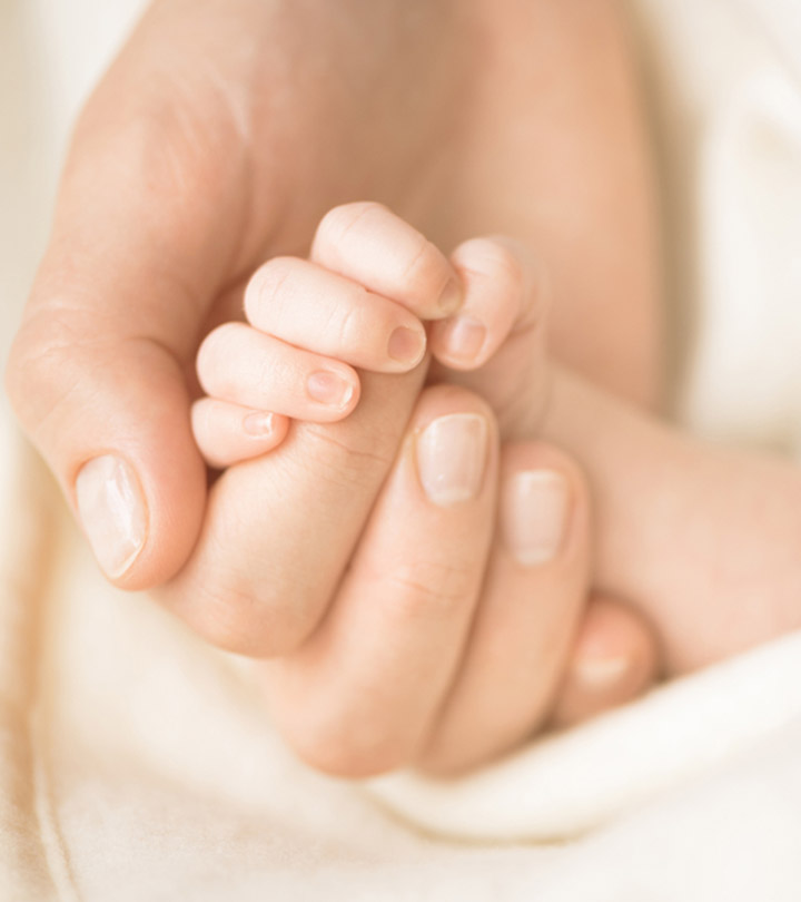 Why & When Your Newborn Holds On To Your Finger